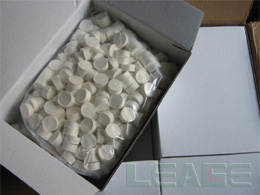 Compressed coin tissue packaging